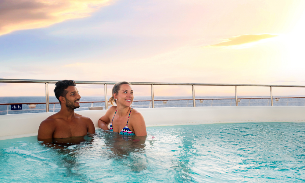 Couple in the pool abord Explorer of the seas on their Mediterranean Royal Caribbean Cruise