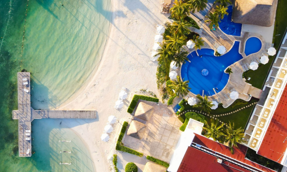 Aerial view of Cancun Bay Resort showing pool area, hotel and beach