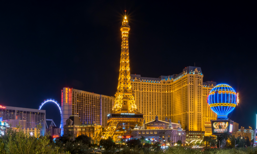 Las Vegas Paris Hotel surrounded with other resorts Eiffel Tower lit up at night in the glowing lights of Las vegas 