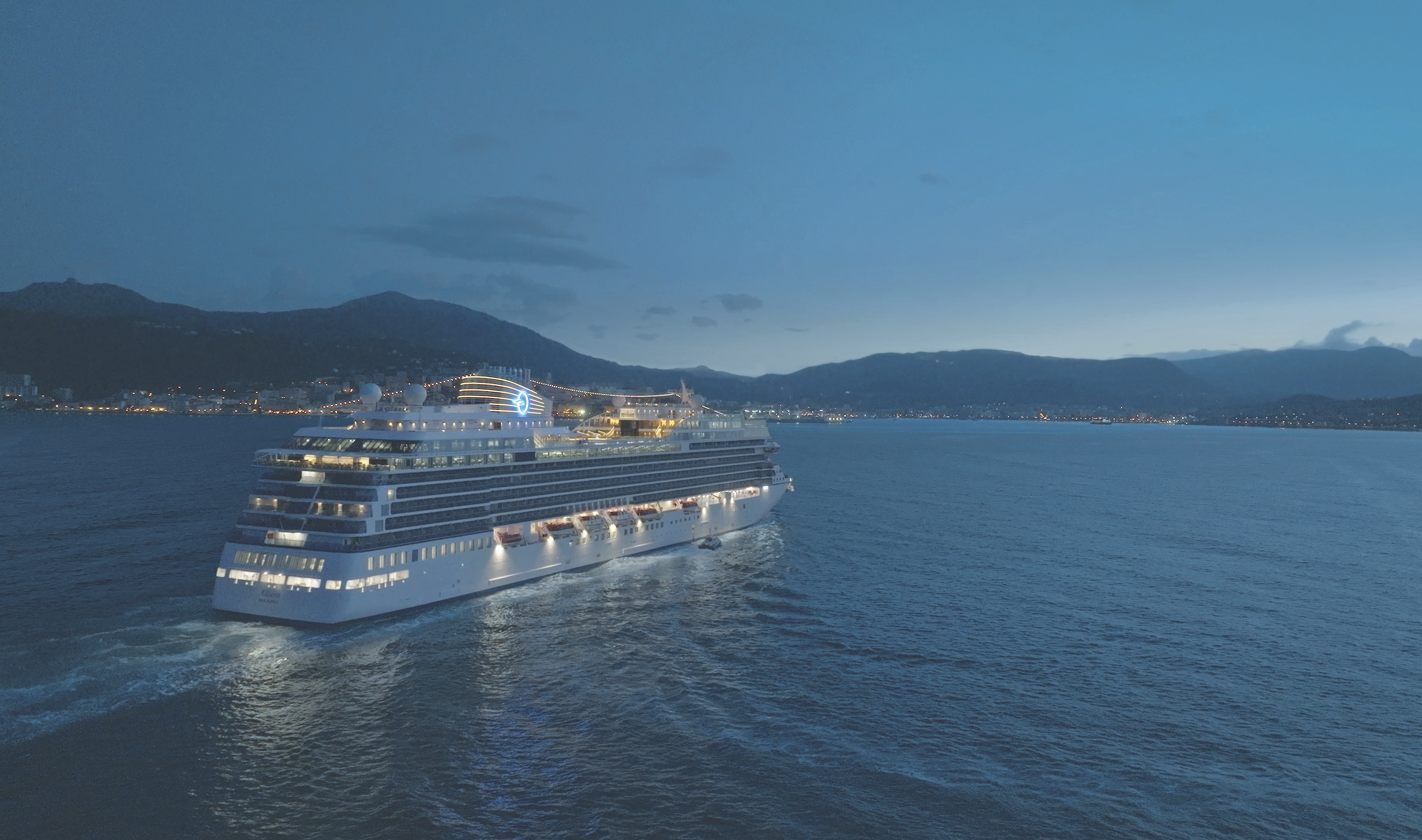 Aerial Image of Oceania Allura cruising at night in Corsica
